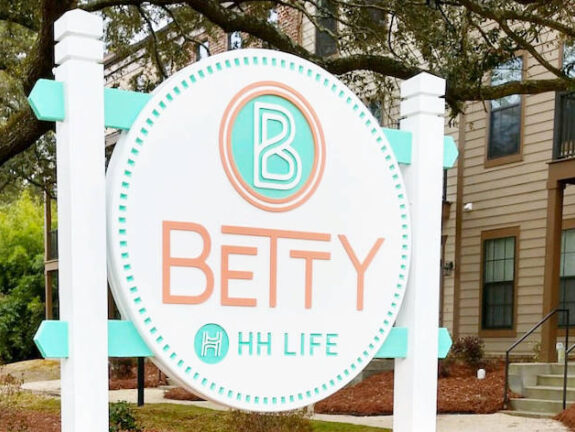 The Betty entrance banner with The Betty logo and contact information